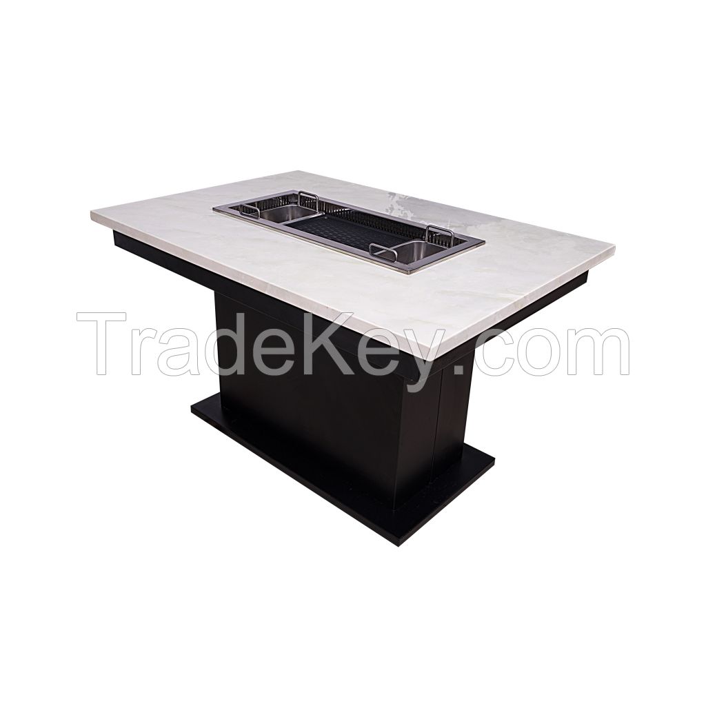 restaurant or home used table with korean bbq grill and hot pot