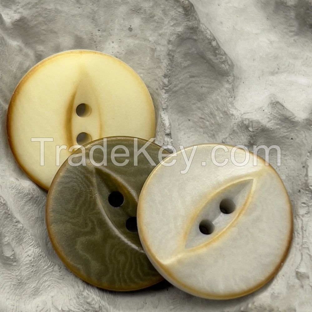 Unusual designer fish eye corozo buttons with scorched effect