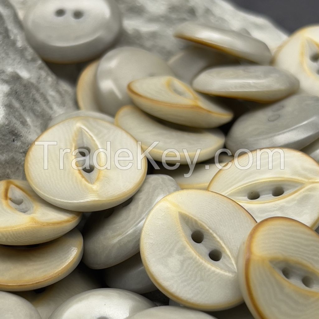 Unusual designer fish eye corozo buttons with scorched effect
