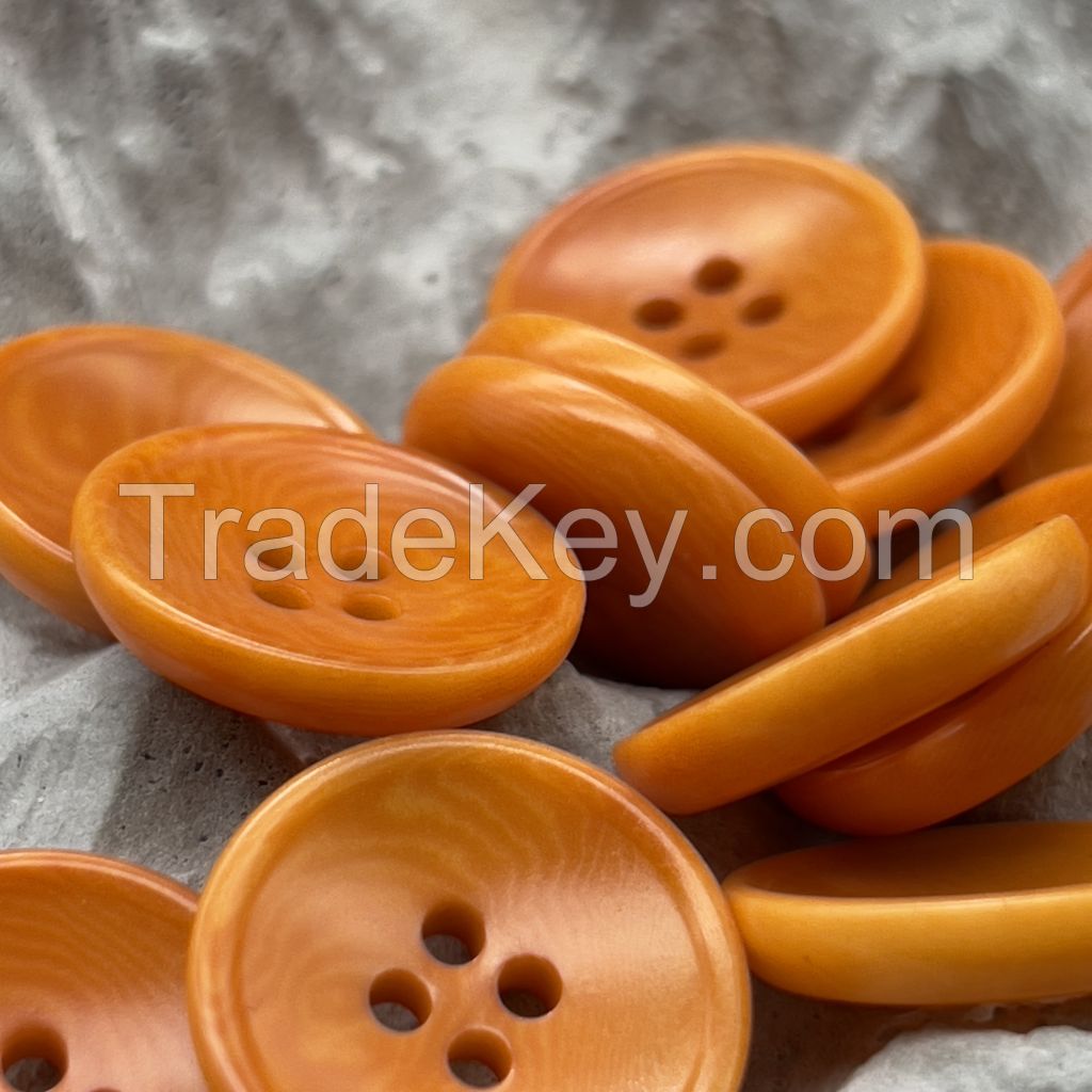 Bowl shape corozo buttons in white, orange, ginger, chesnut and black